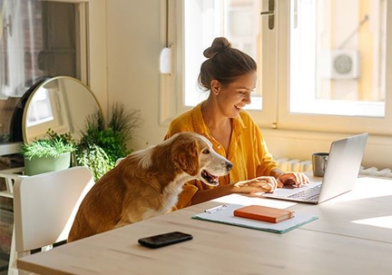 woman sitting with dog