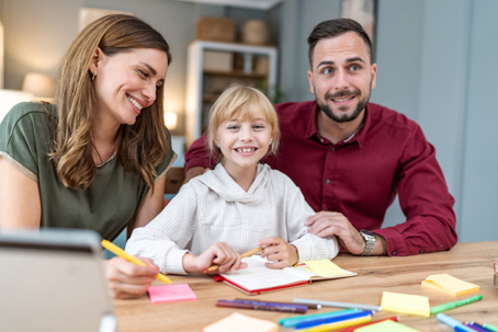 parents with child in an office